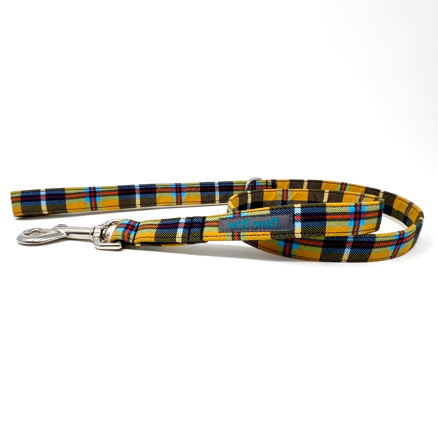Plaid dog leash in yellow, orange, blue and black makes up the Cornish tartan pattern