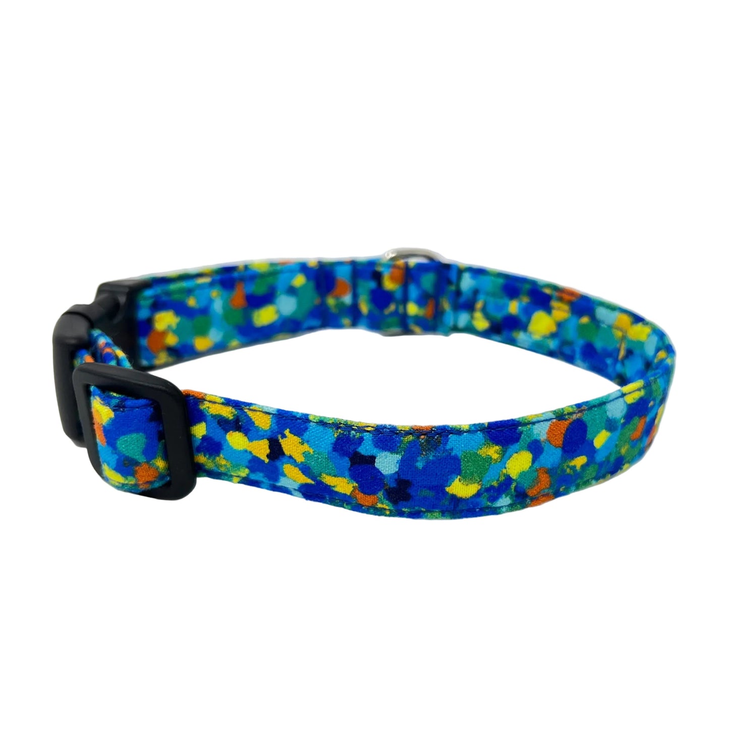 Dog collar with splattered dots of blues and a touch of yellow, green and orange.