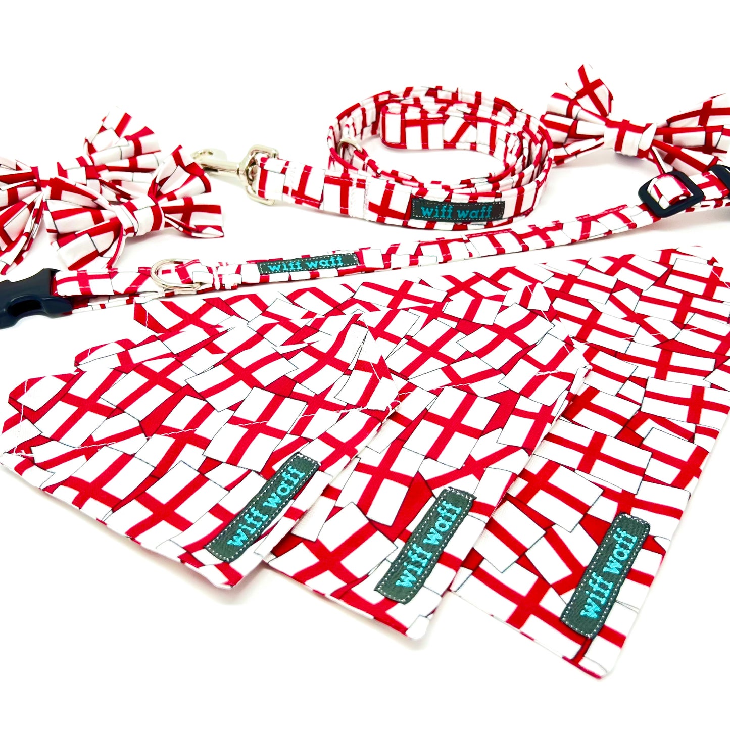 Red and white St Georges Flag dog lead, dog collar, dog bow tie and dog bandana with a visible brand tag on a white background
