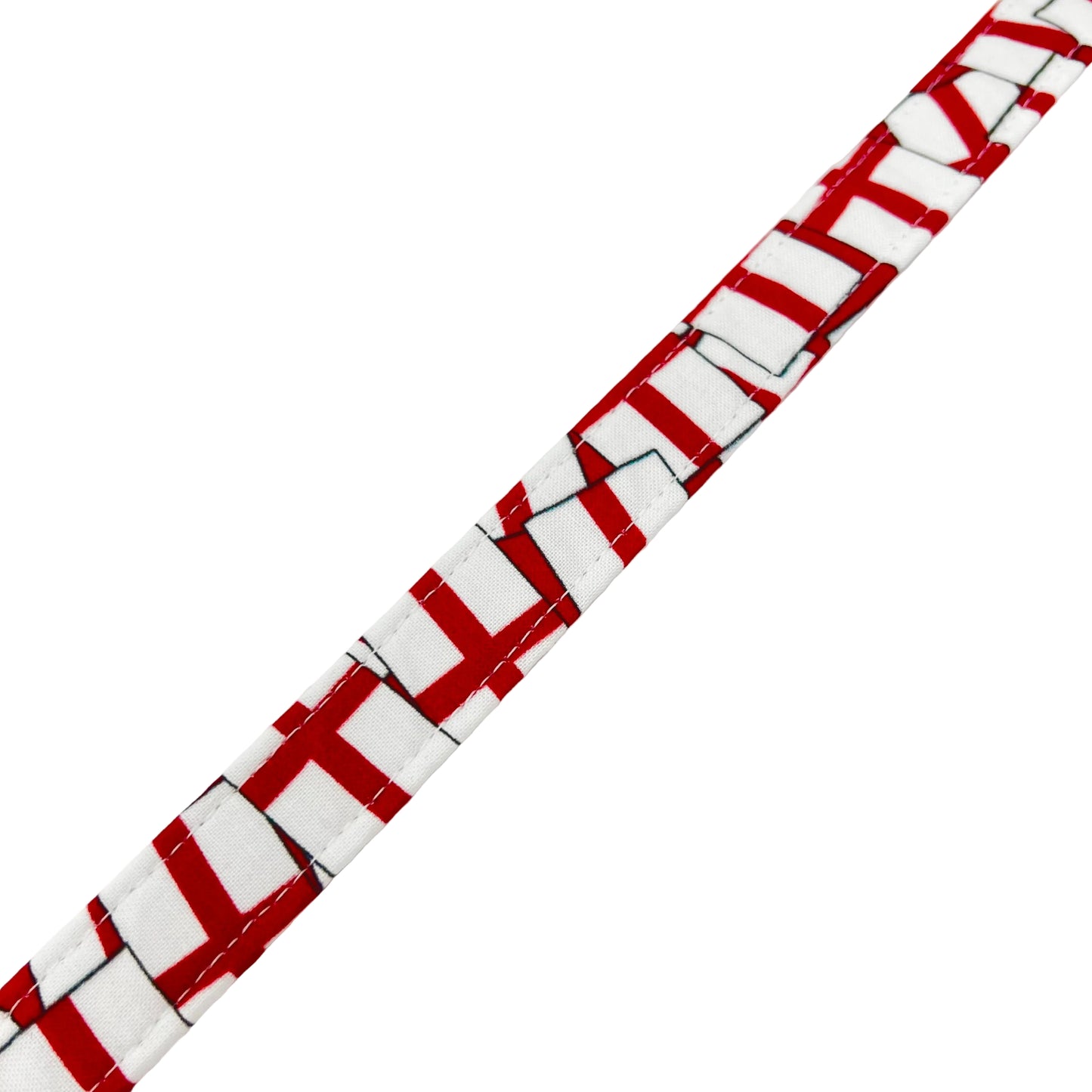 Red and white St Georges Flag dog lead with a visible brand tag on a white background