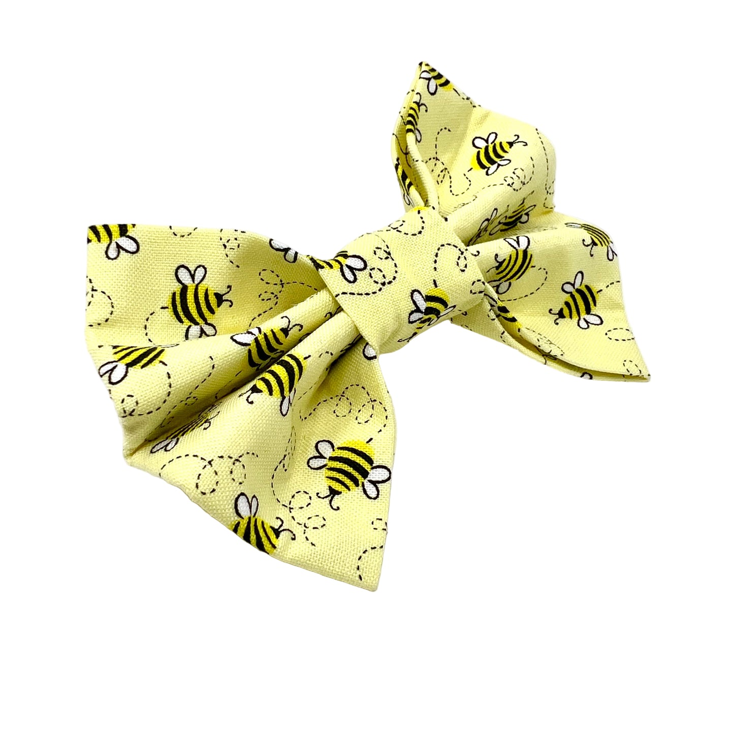 Pale yellow bow with bright bee pattern all over it