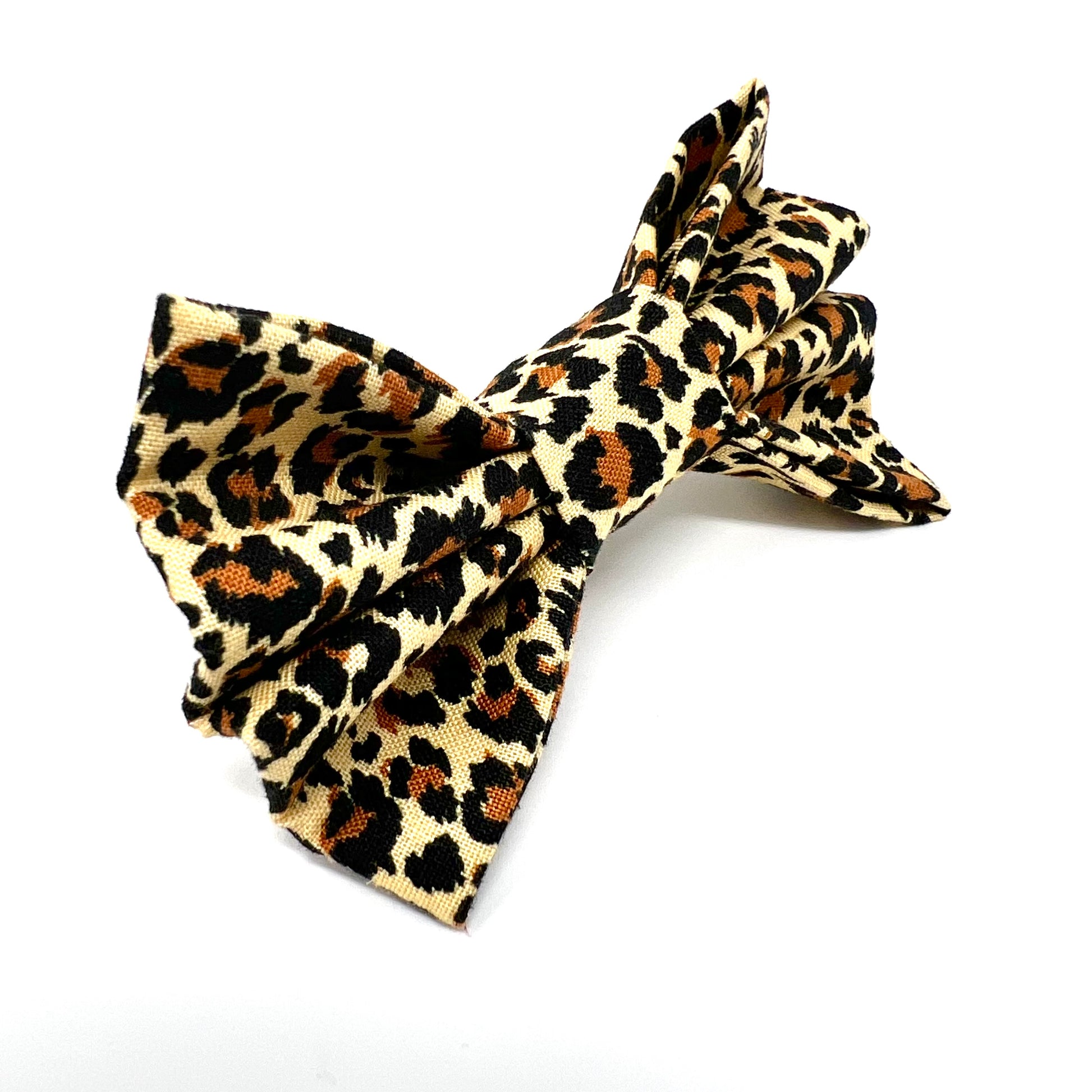 brown, black and beige colours make up this quality leopard print dog bow which attaches by elastic to a collar