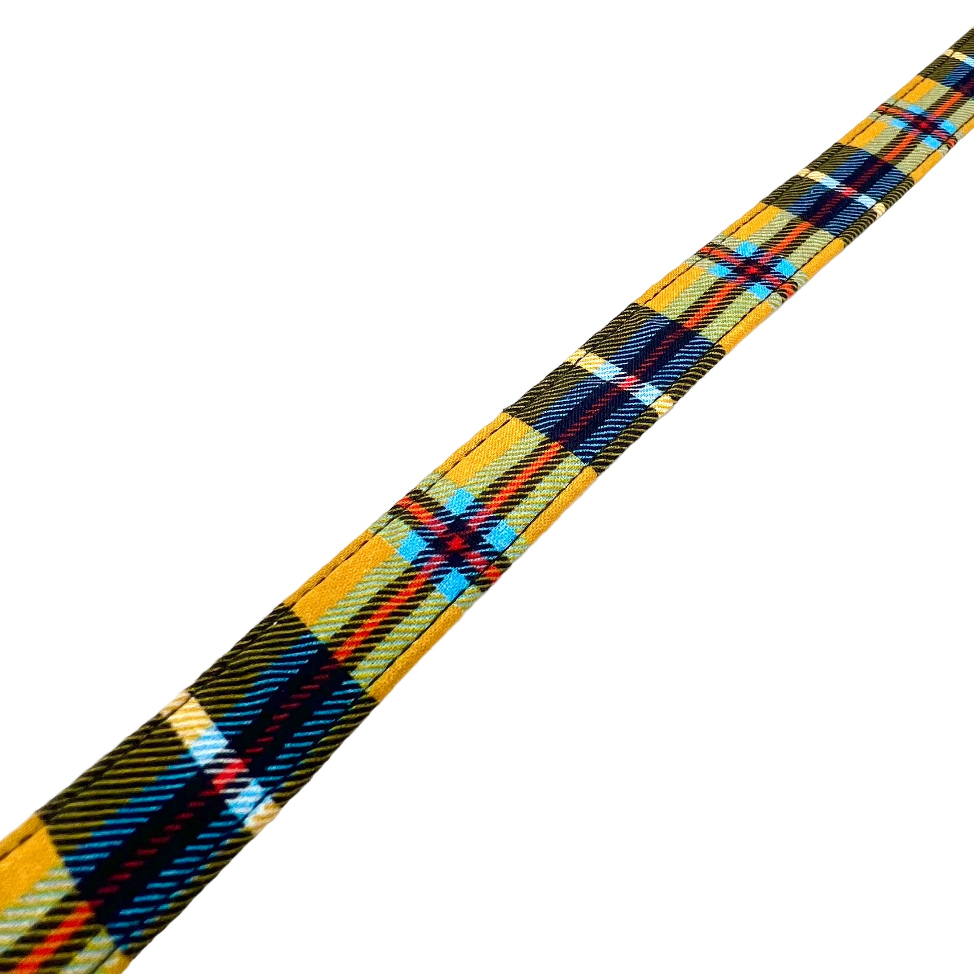 Plaid ribbon with yellow, blue, and red pattern on a white background