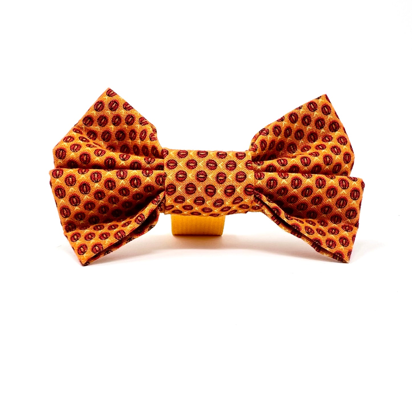 Tiny orange pineapples making an abstract design on the fabric of this bowtie