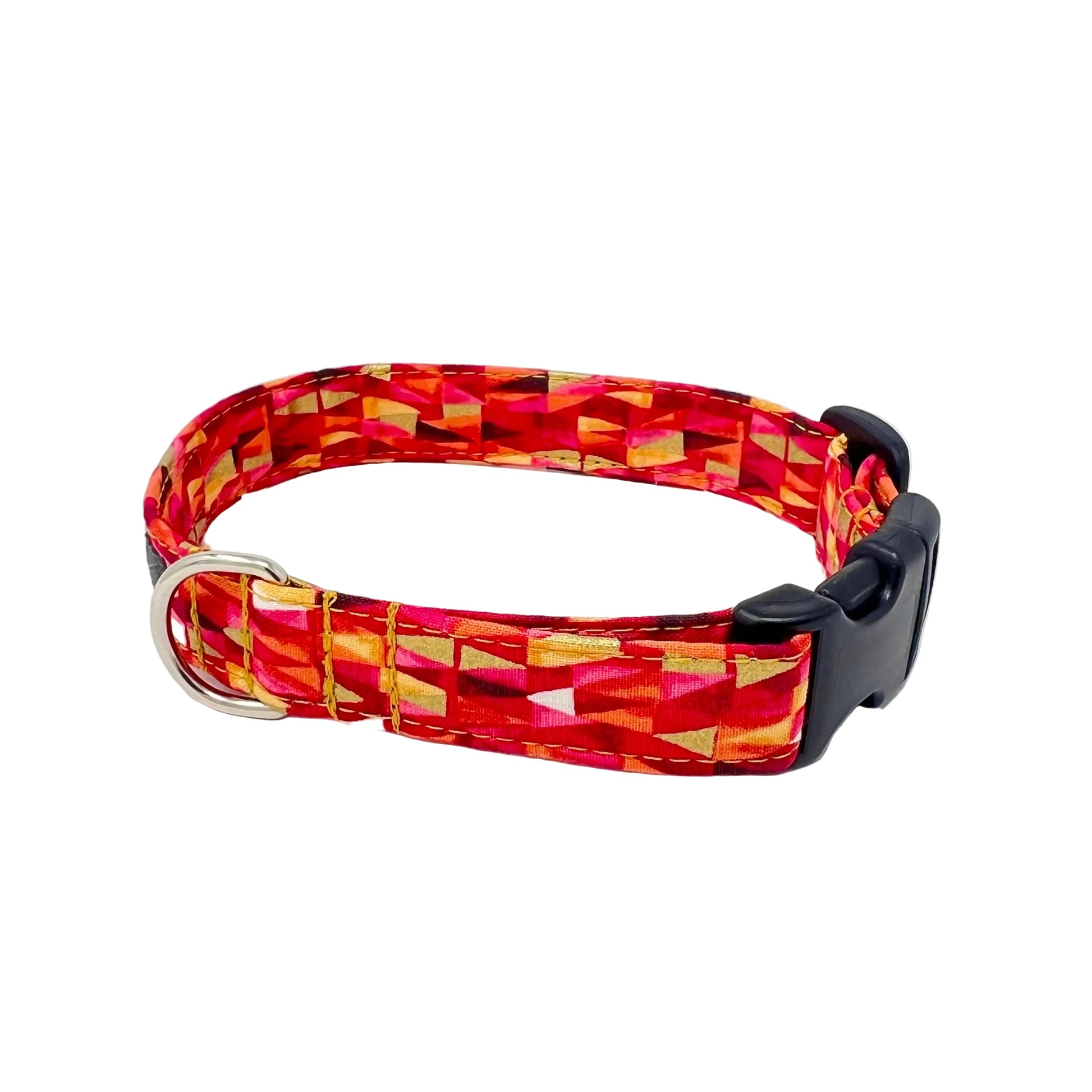 Fabric reinforced dog collar with a triangular pattern in shades of pinks and reds with gold metallic highlights