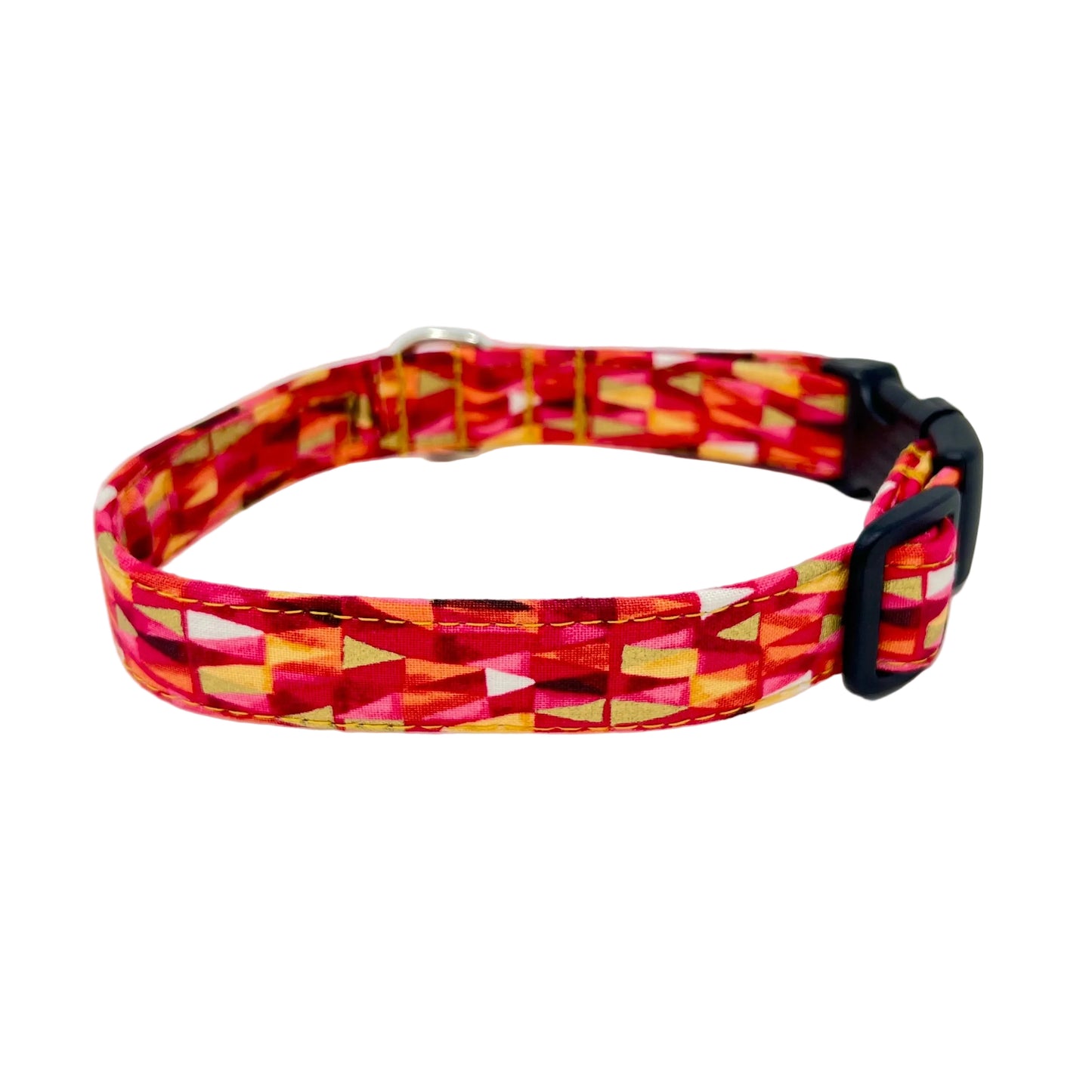 Fabric reinforced dog collar with a triangular pattern in shades of pinks and reds with gold metallic highlights