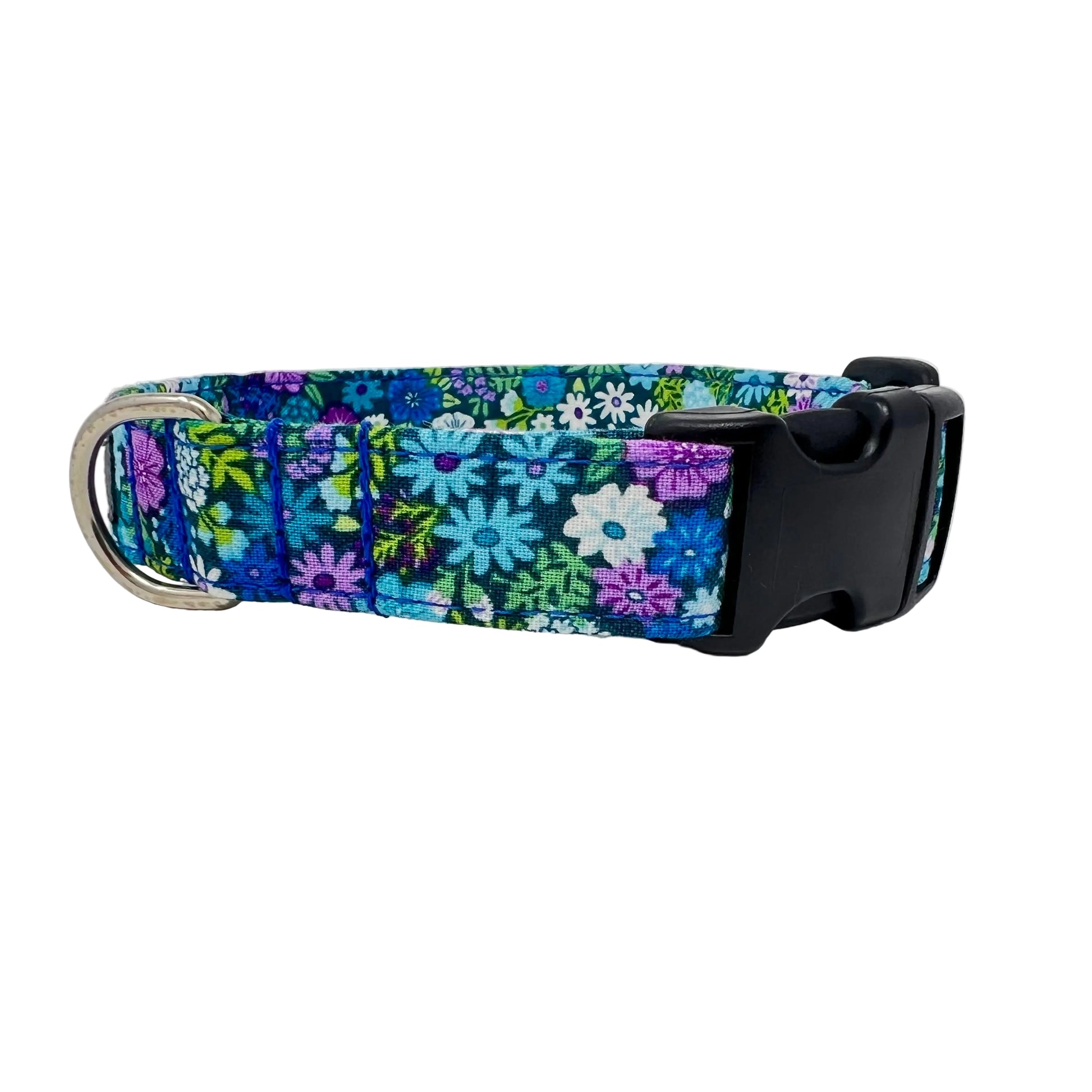 dog collar features a vibrant floral design in shades of blue, violet, green and white