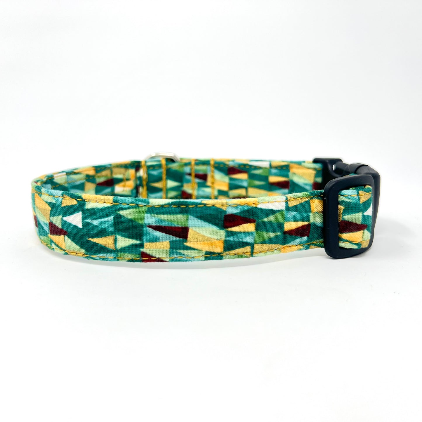 Dog collar with geometric triangular shapes in shades of green with gold metallic highlights.