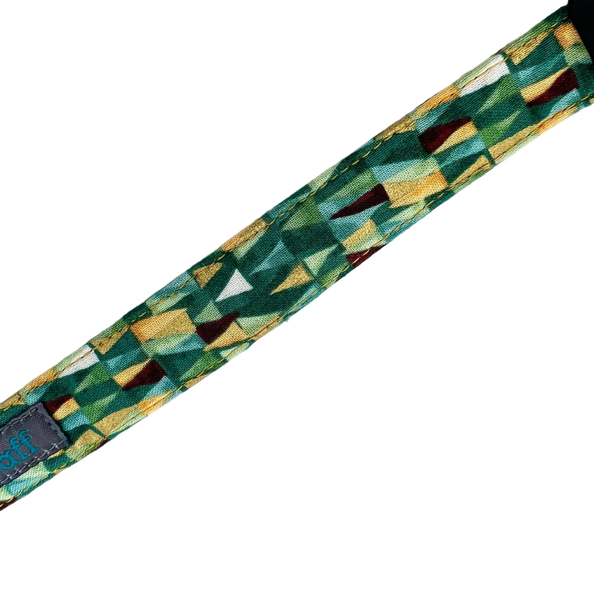 Dog collar with geometric triangular shapes in shades of green with gold metallic highlights.
