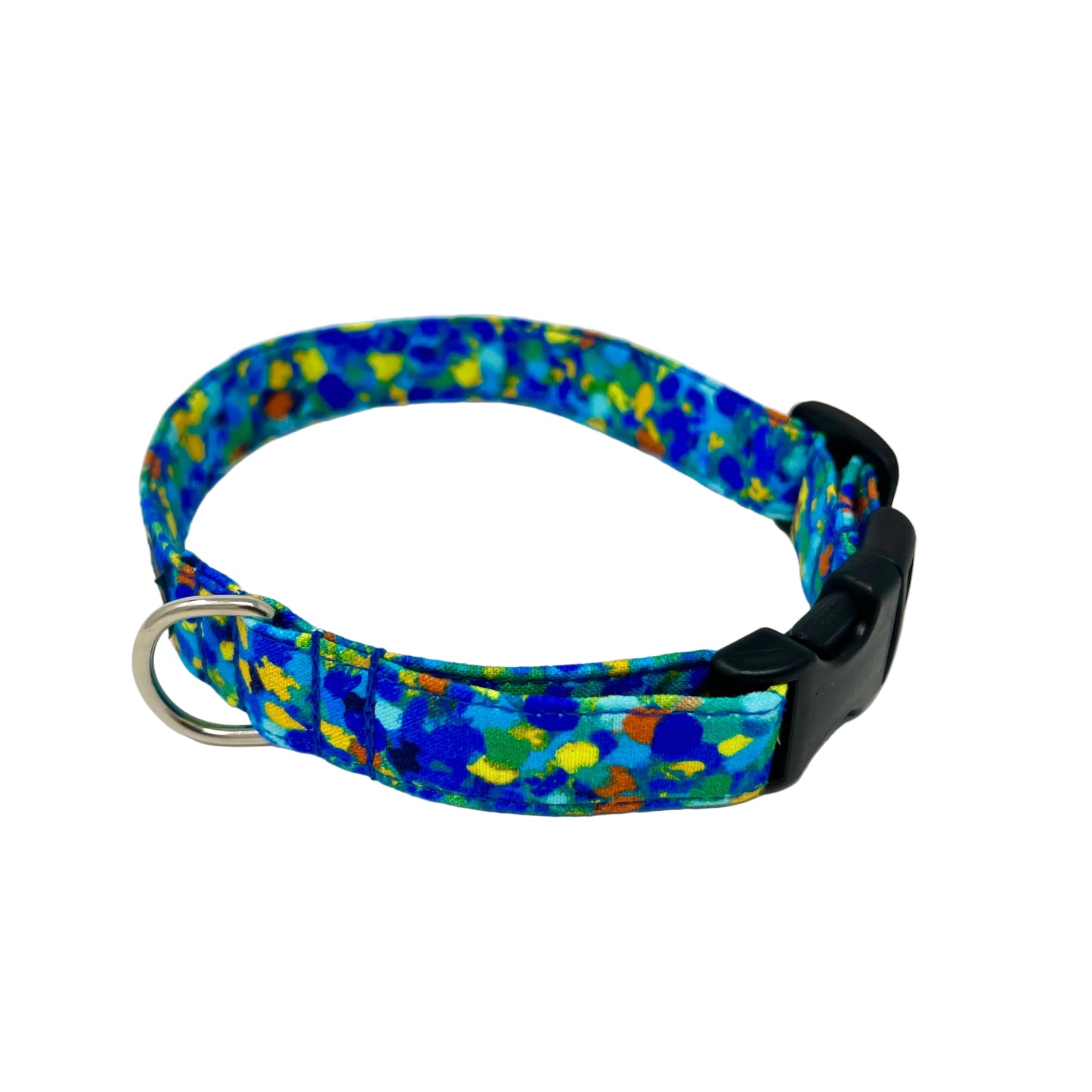 Dog collar with splattered dots of blues and a touch of yellow, green and orange.