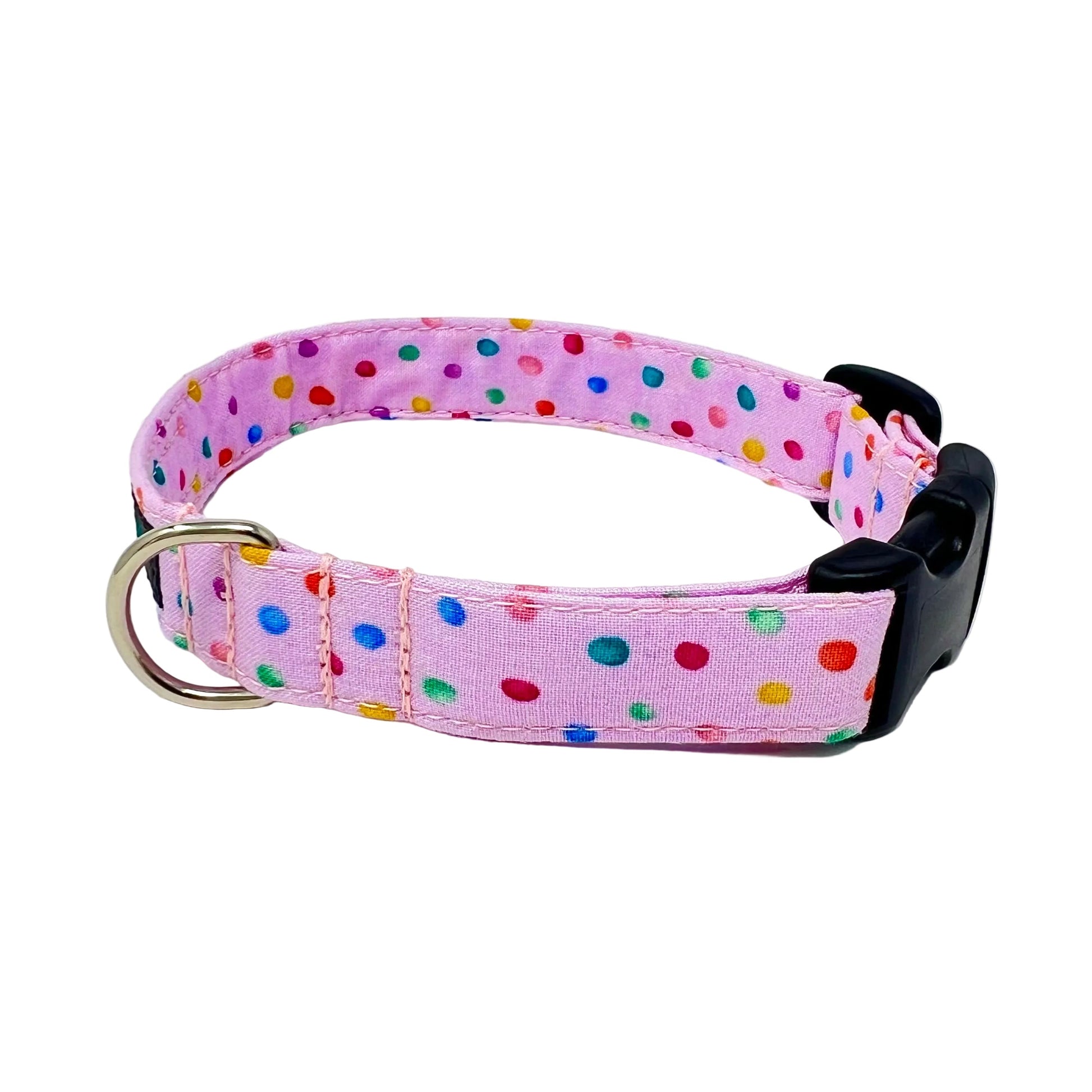 dog collar with a pink back ground with tiny colourful rainbow bubbles scattered across it