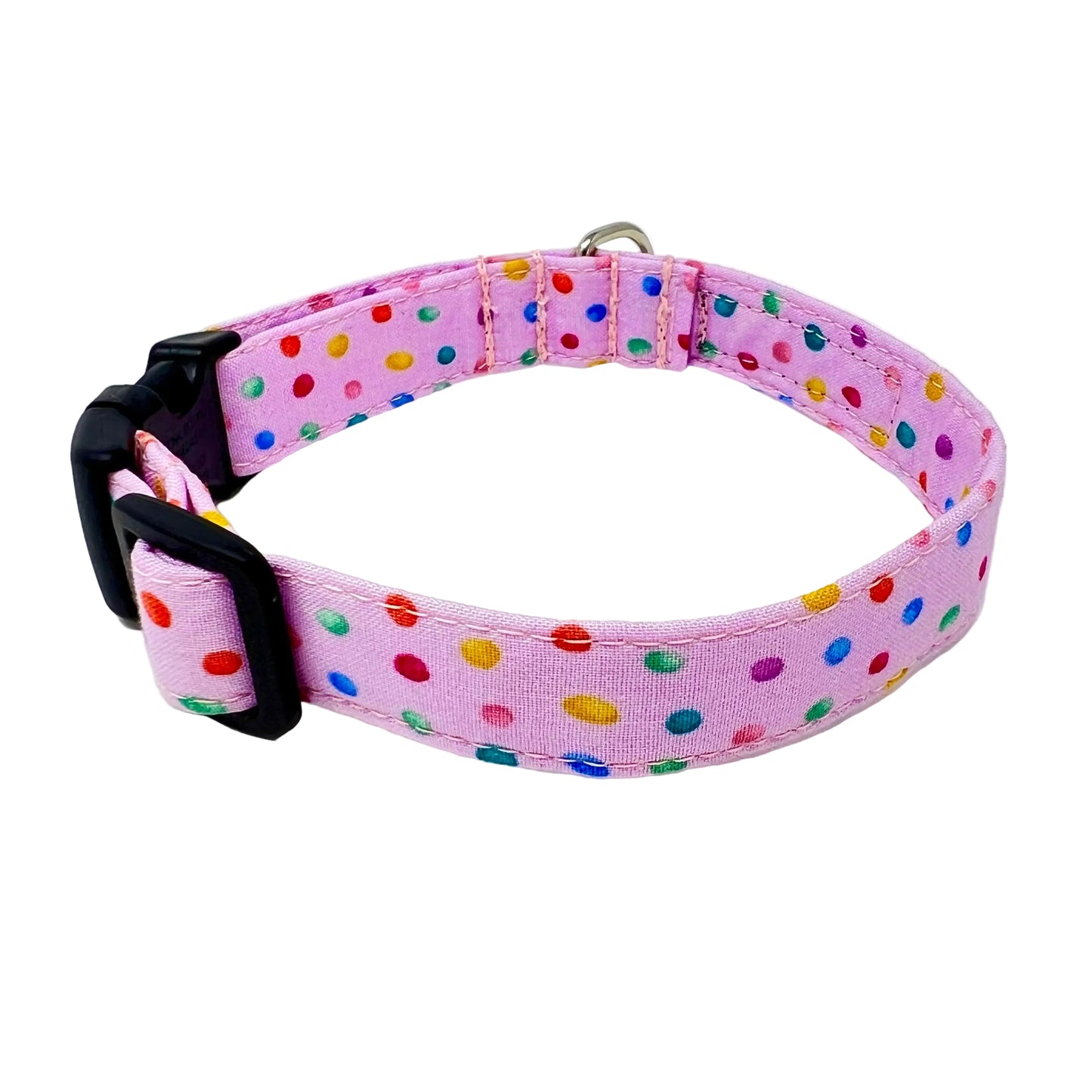 dog collar with a pink back ground with tiny colourful rainbow bubbles scattered across it