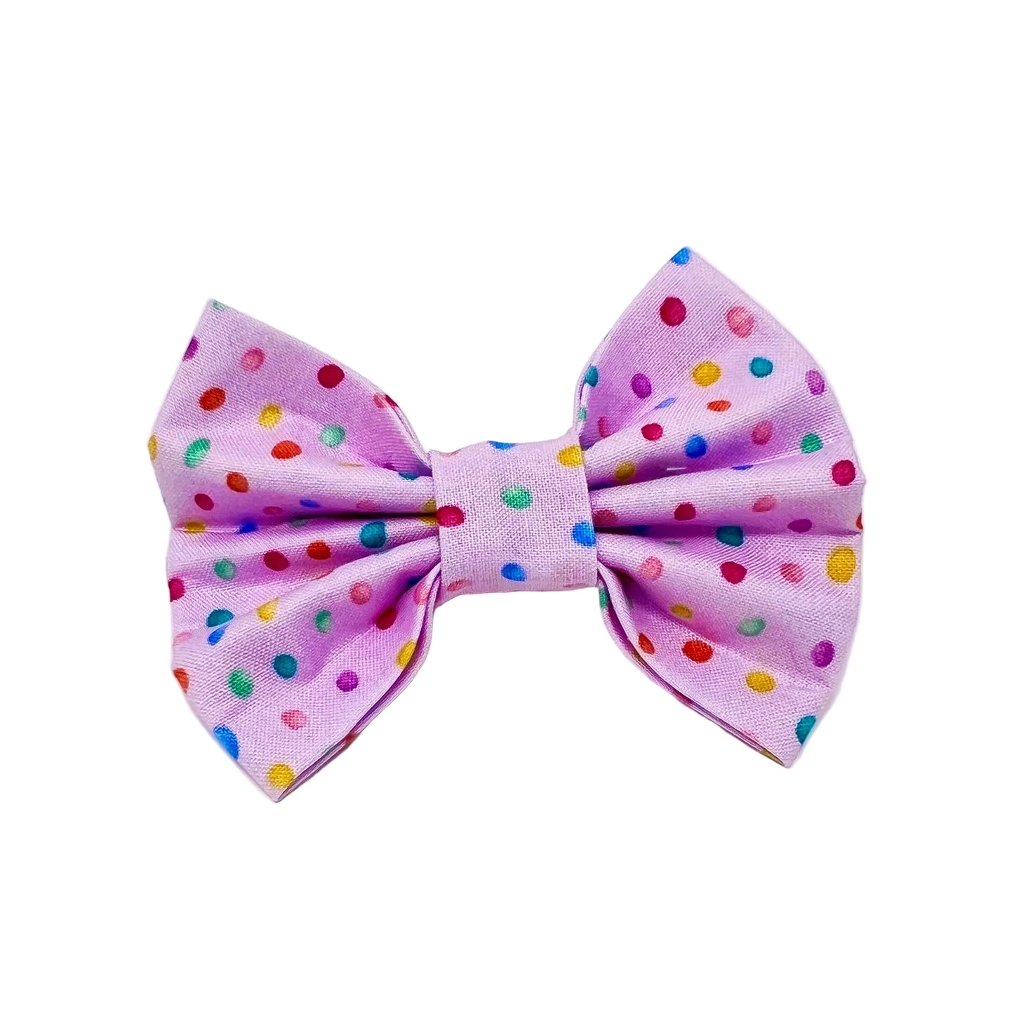 dog bow with a pink back ground and tiny colourful rainbow bubbles scattered across it. feminine 