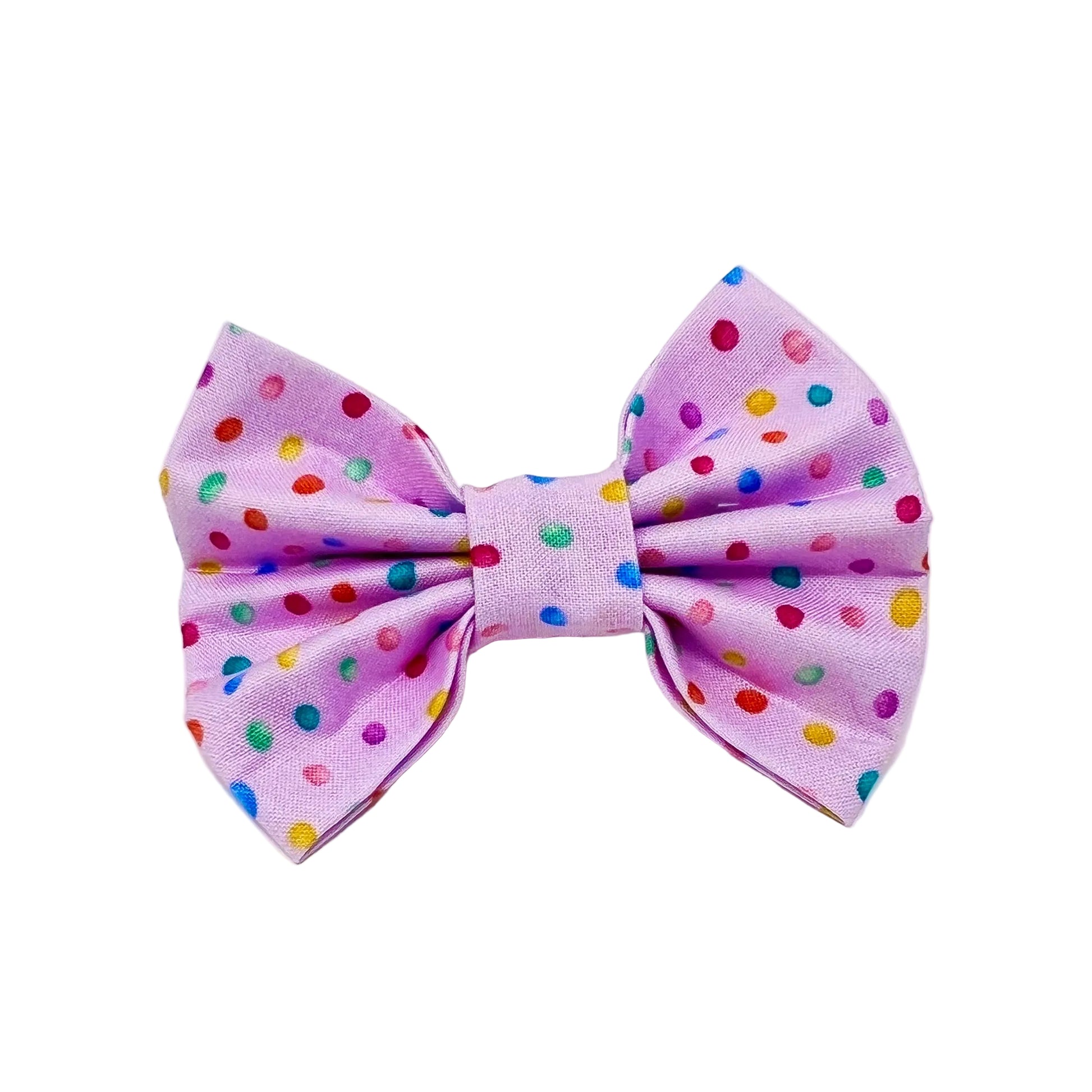 dog bow with a pink back ground and tiny colourful rainbow bubbles scattered across it. feminine 