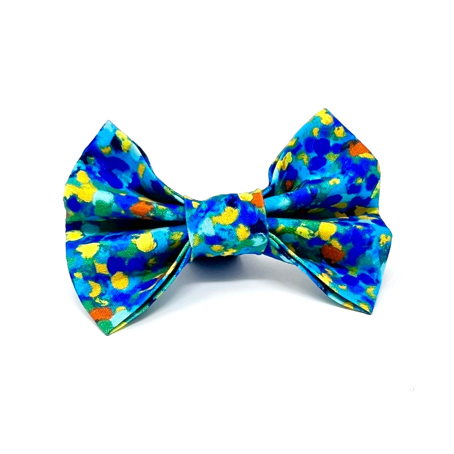 Bow tie composed of various blue tones, complemented by subtle accents of yellow, orange, and green.